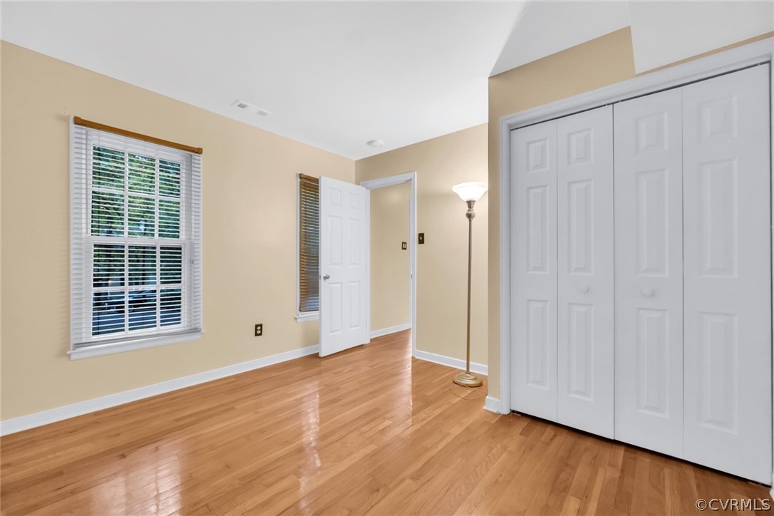 5824 Mill Spring Road Midlothian, VA 23112 - Photo 11 of 29 an empty room with wooden floor and windows