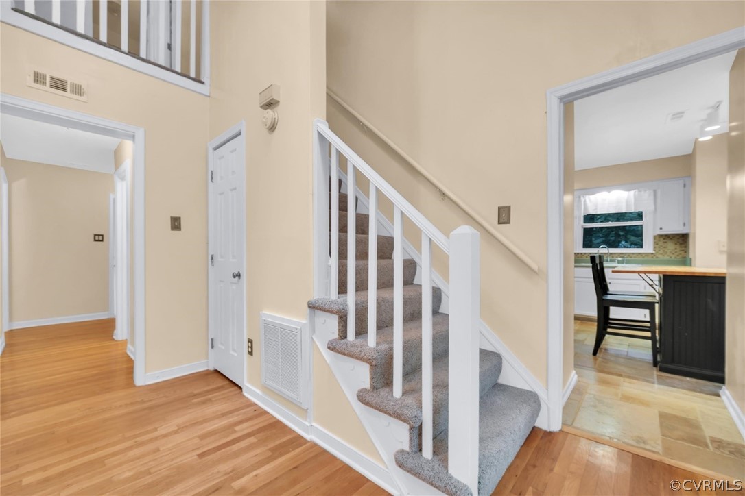 5824 Mill Spring Road Midlothian, VA 23112 - Photo 13 of 29 a view of a hallway with wooden floor and staircase