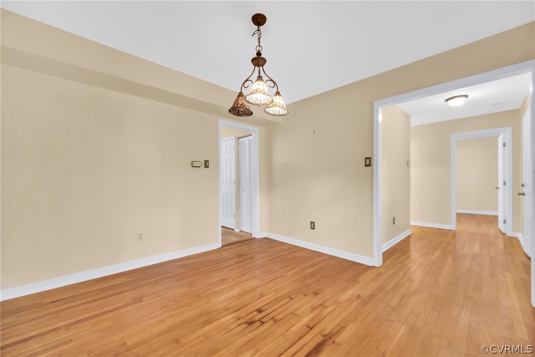 5824 Mill Spring Road Midlothian, VA 23112 - Photo 17 of 29 a view of a chandelier in big room and empty room