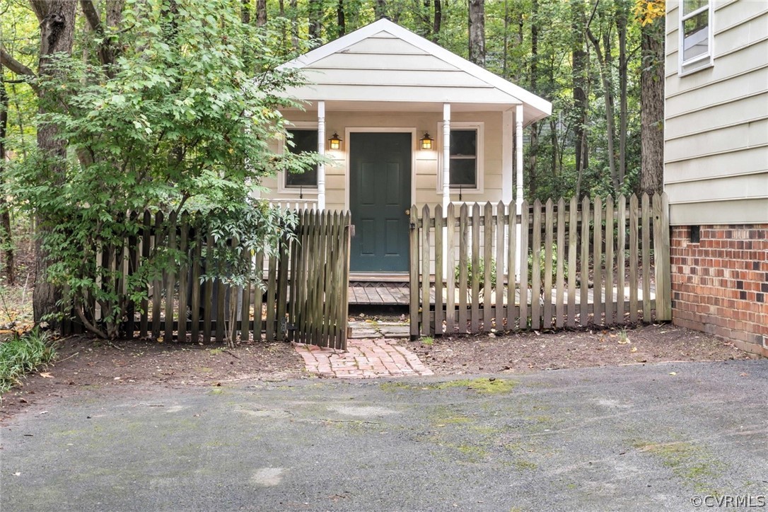 5824 Mill Spring Road Midlothian, VA 23112 - Photo 28 of 29 a view of a house with a small yard and plants