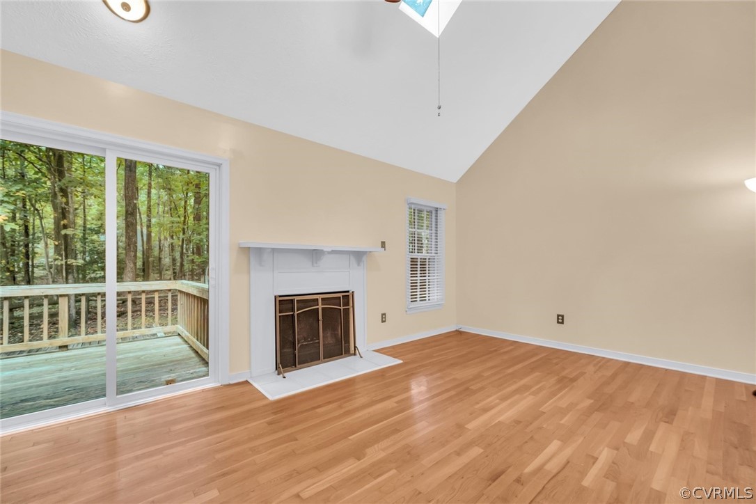 5824 Mill Spring Road Midlothian, VA 23112 - Photo 4 of 29 wooden floor fireplace and windows in an empty room