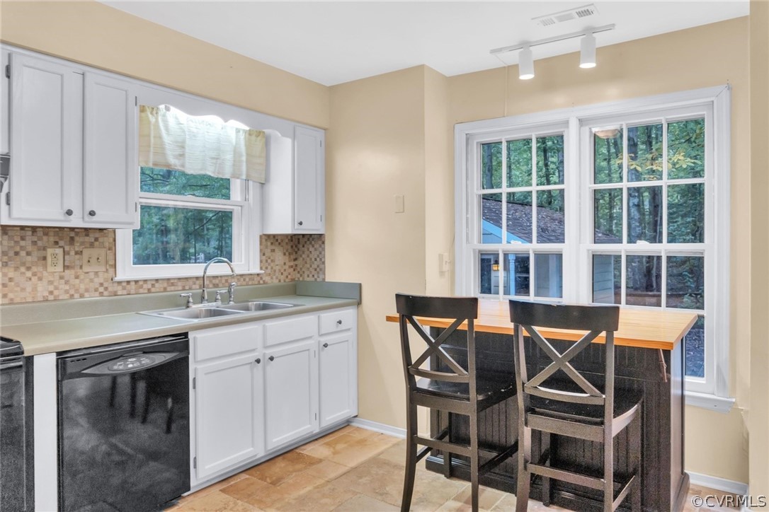 5824 Mill Spring Road Midlothian, VA 23112 - Photo 9 of 29 a table and chairs in a kitchen