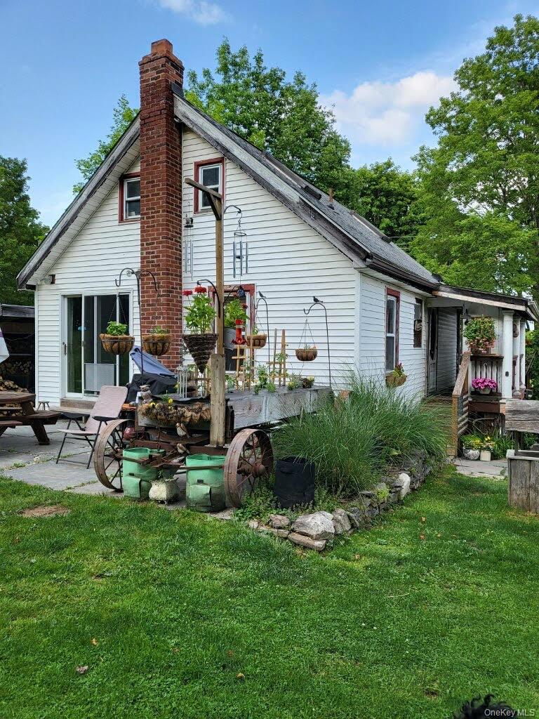 174 Rock Ridge Avenue Monticello, NY 12701 - Photo 11 of 11 a view of a house with backyard and sitting area