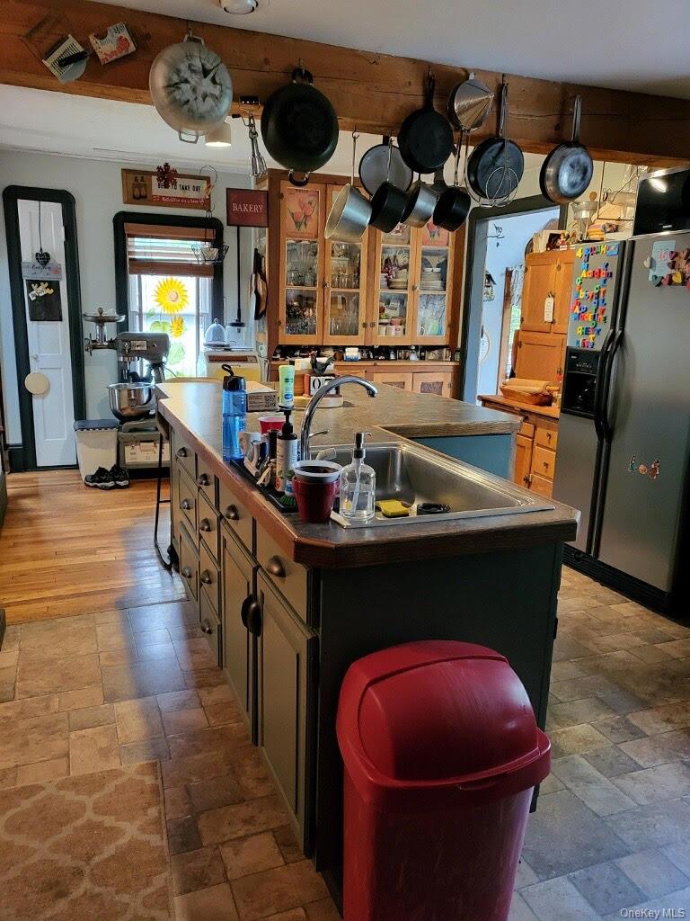 174 Rock Ridge Avenue Monticello, NY 12701 - Photo 3 of 11 a kitchen with stainless steel appliances granite countertop a sink a stove and a wooden floors