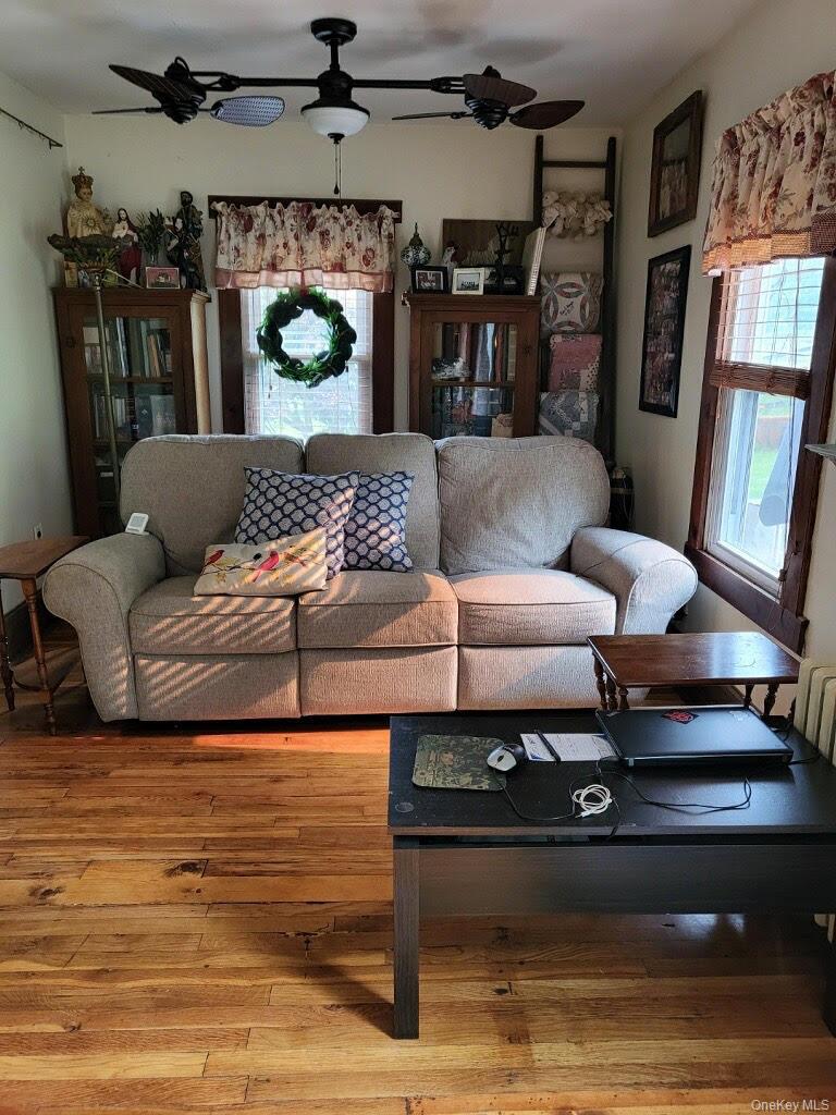 174 Rock Ridge Avenue Monticello, NY 12701 - Photo 6 of 11 a living room with furniture fireplace and window