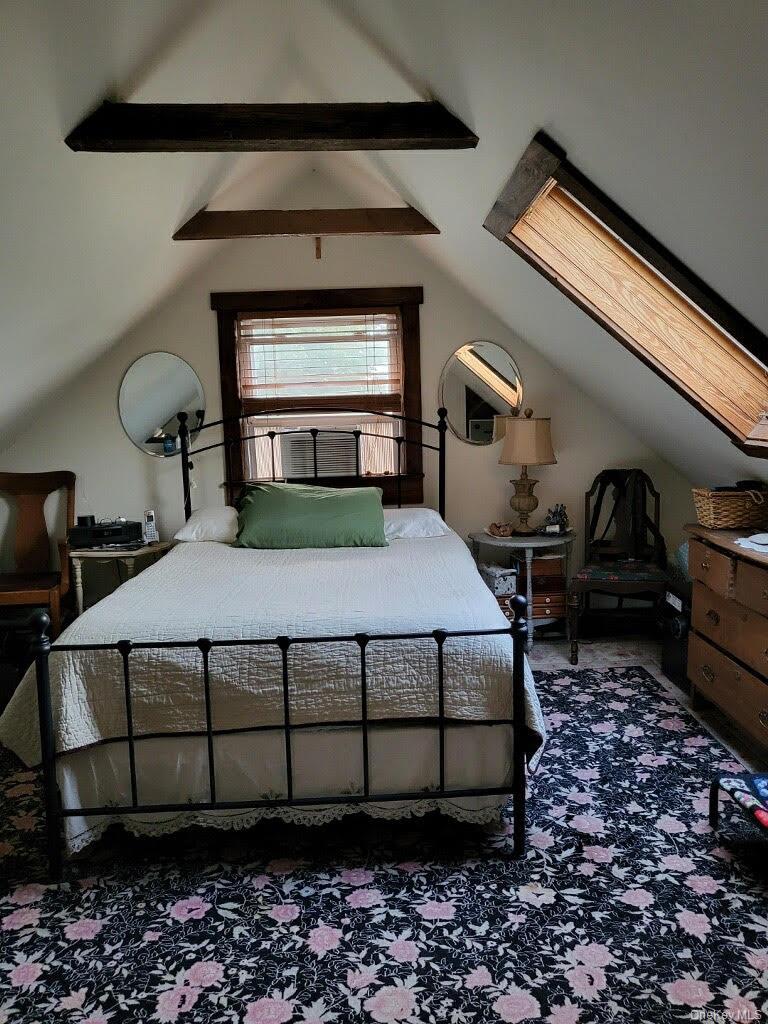 174 Rock Ridge Avenue Monticello, NY 12701 - Photo 8 of 11 a bedroom with a bed lamp and a fireplace