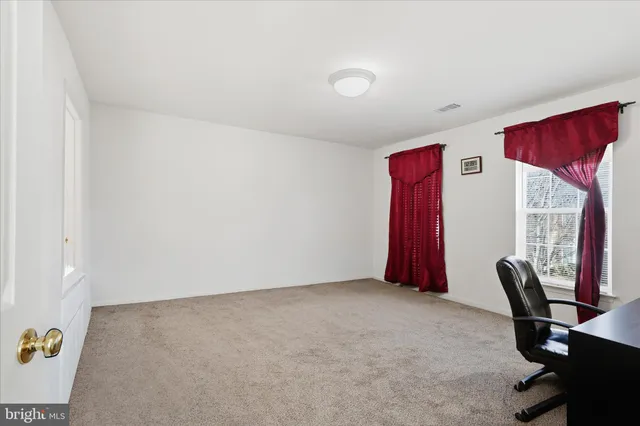 a view of a livingroom with a workspace