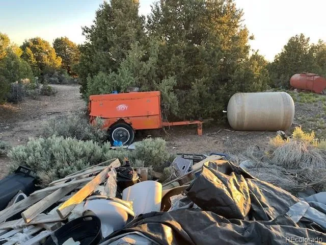 a backyard of a house with outdoor seating