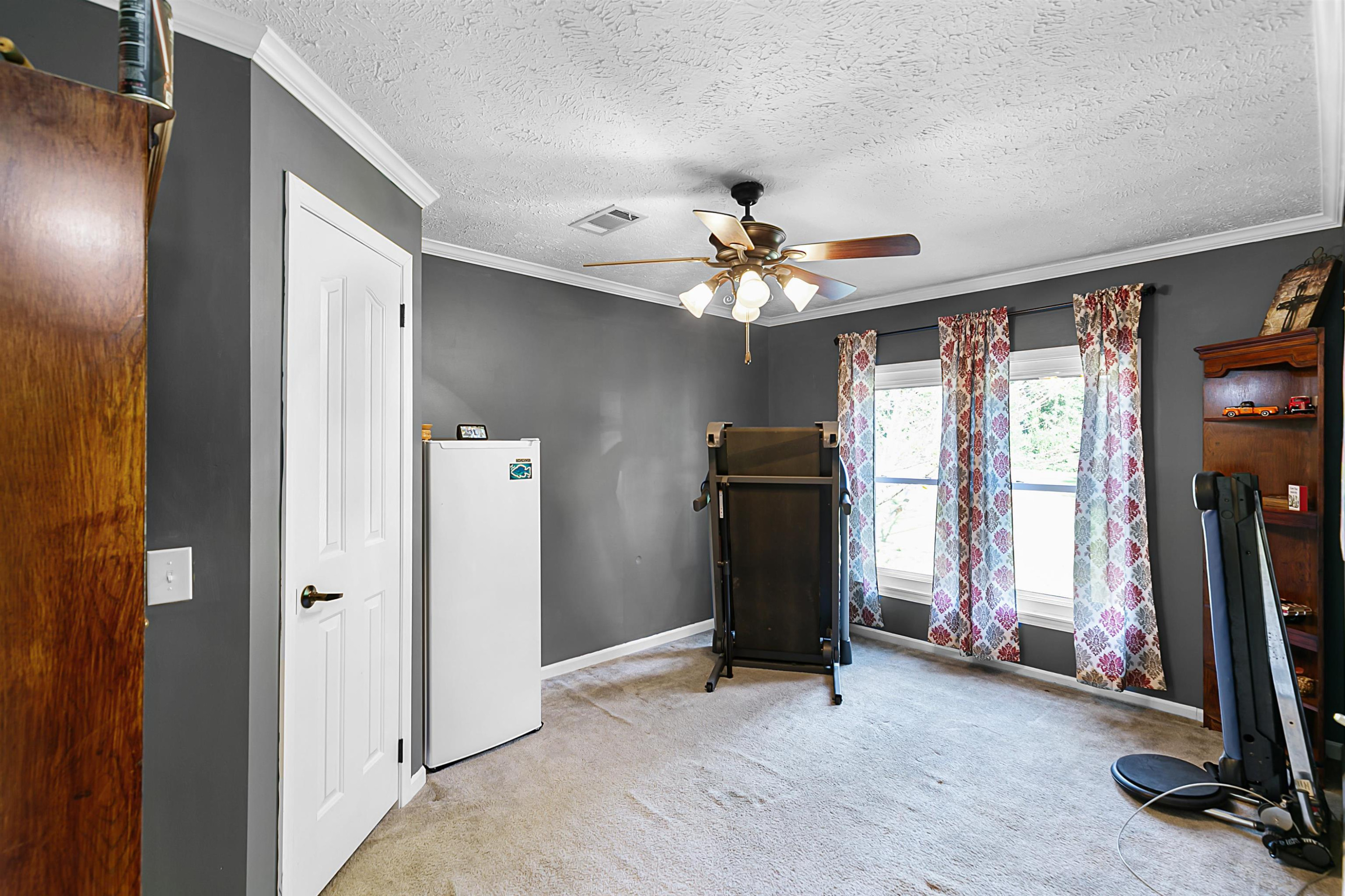 828 Browns Church Road Jackson, TN 38305 - Photo 18 of 26 a view of a room with gym equipment
