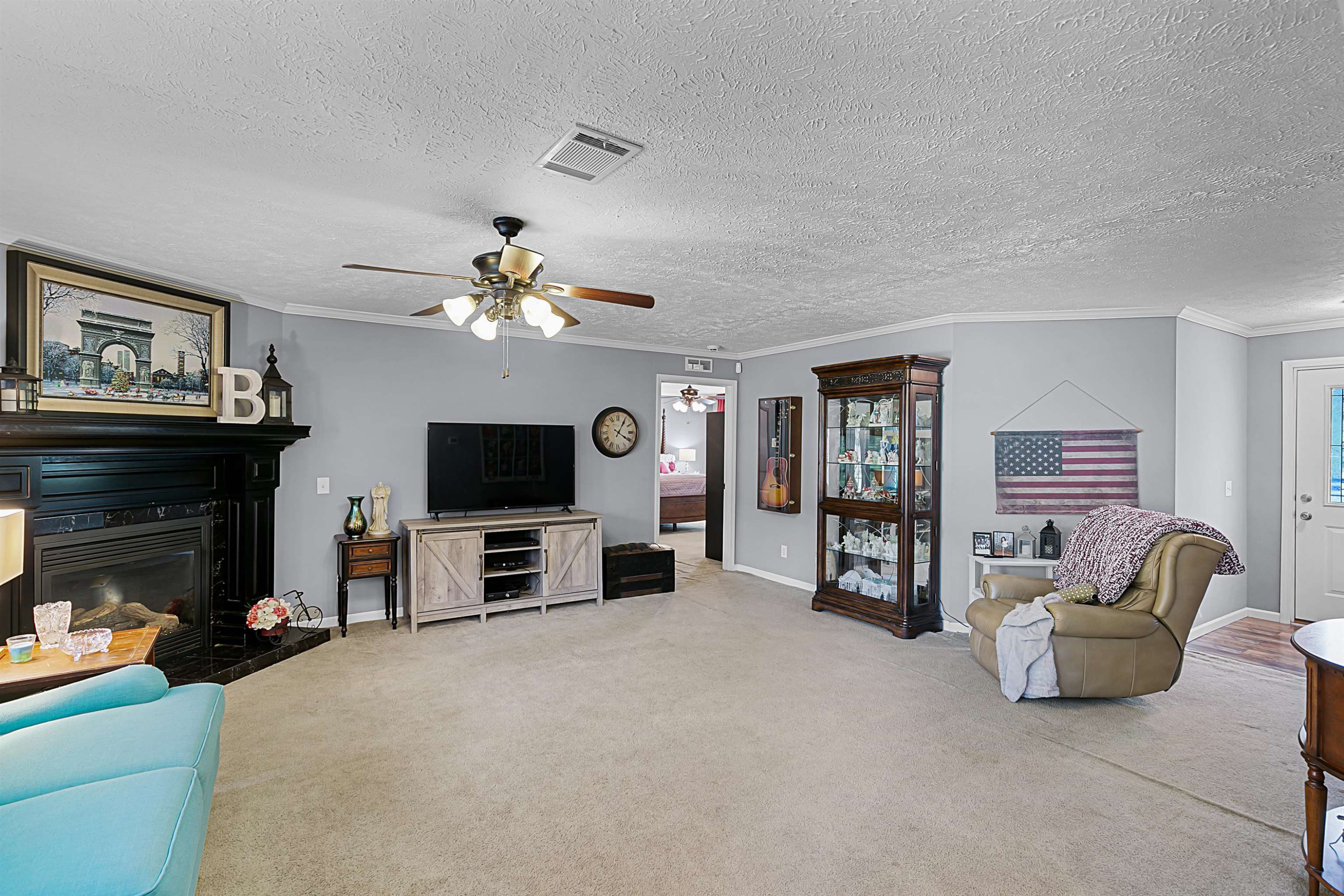 828 Browns Church Road Jackson, TN 38305 - Photo 3 of 26 a living room with furniture and a fireplace