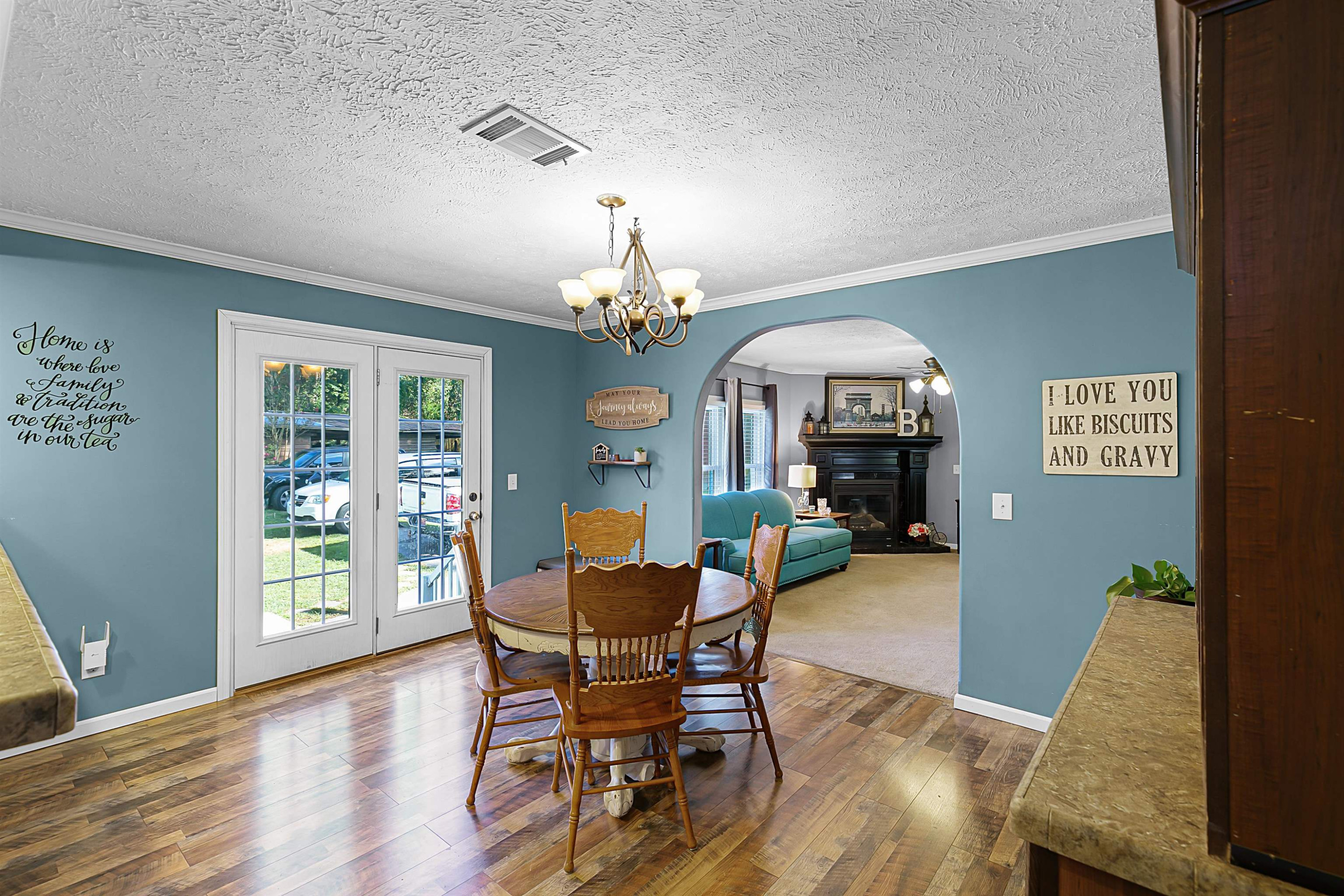 828 Browns Church Road Jackson, TN 38305 - Photo 5 of 26 a view of a dining room with furniture window and wooden floor