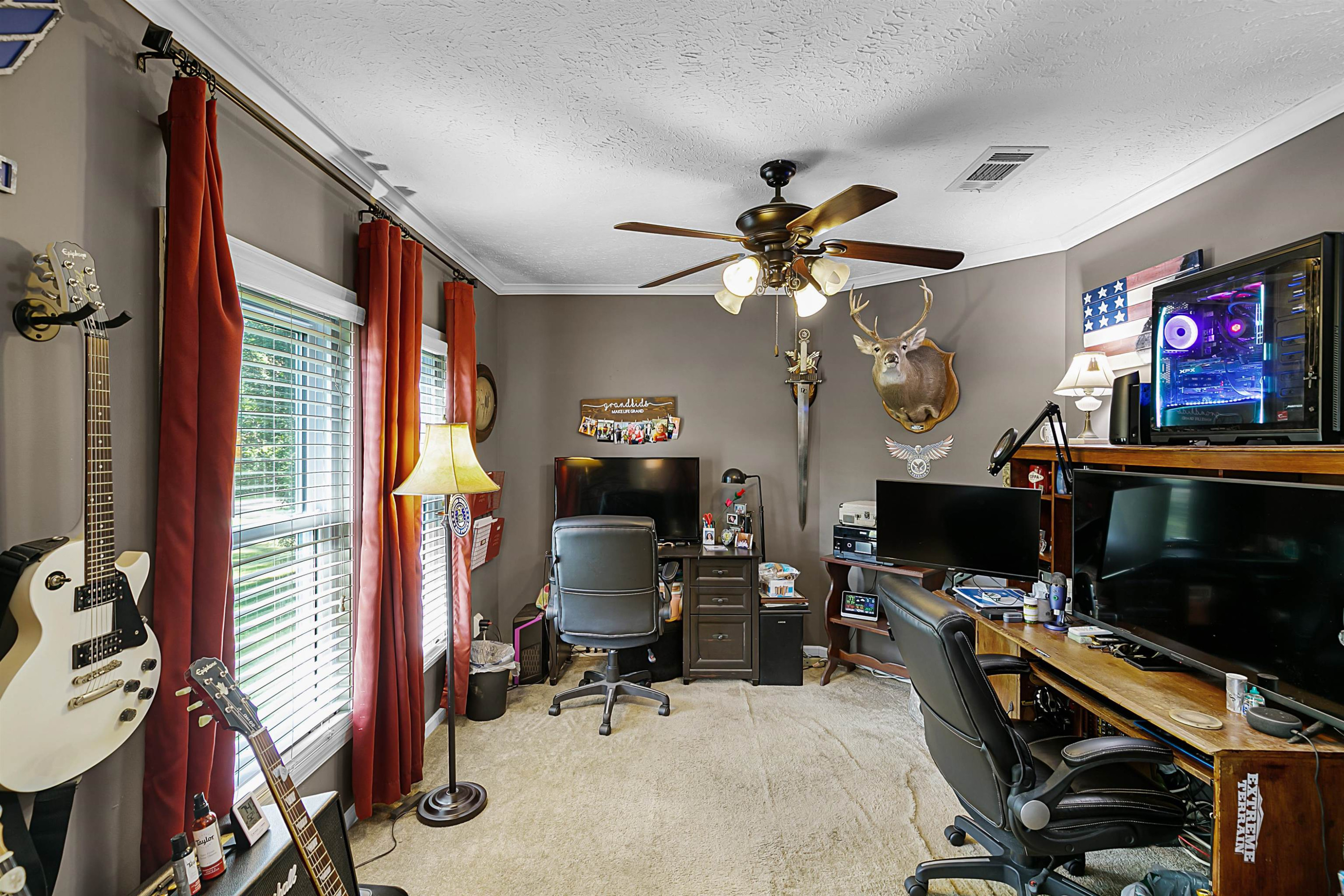 828 Browns Church Road Jackson, TN 38305 - Photo 10 of 26 a view of a workspace with furniture and a window