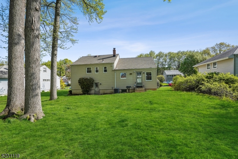 11 North Derby Road Springfield, NJ 07081 - Photo 16 of 30 a front view of a house with a garden
