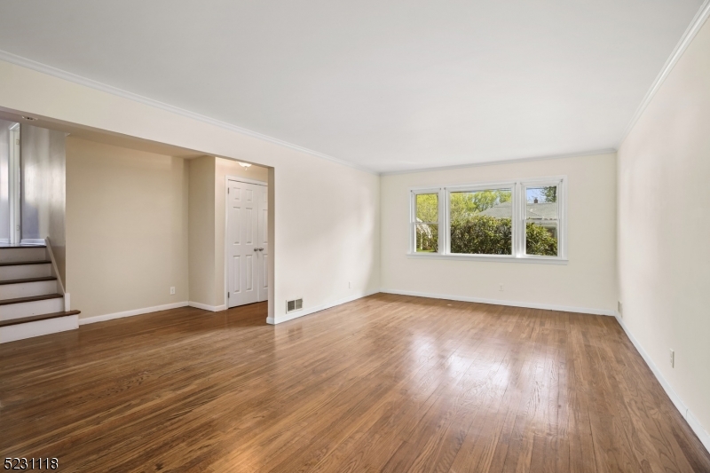 11 North Derby Road Springfield, NJ 07081 - Photo 18 of 30 an empty room with wooden floor and windows
