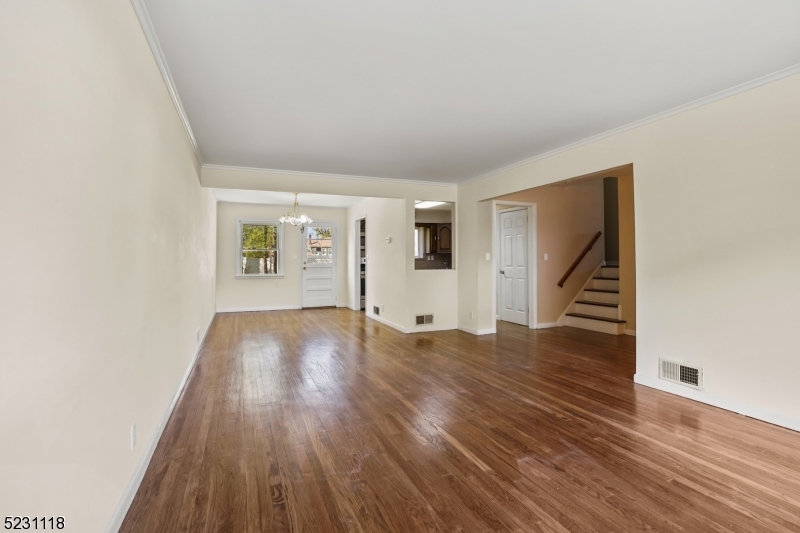 11 North Derby Road Springfield, NJ 07081 - Photo 19 of 30 an empty room with wooden floor and windows