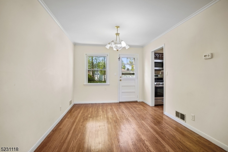 11 North Derby Road Springfield, NJ 07081 - Photo 21 of 30 wooden floor in an empty room with a window