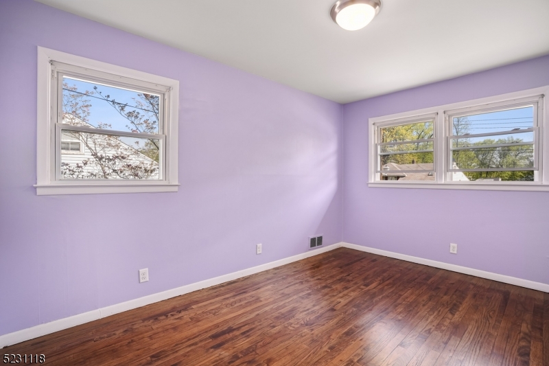 11 North Derby Road Springfield, NJ 07081 - Photo 25 of 30 a view of empty room with wooden floor and fan