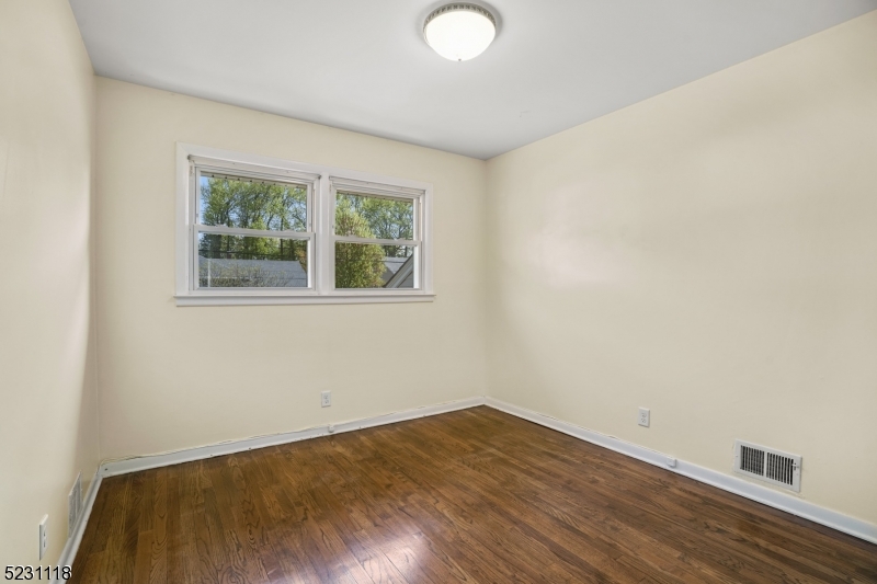 11 North Derby Road Springfield, NJ 07081 - Photo 26 of 30 an empty room with wooden floor and windows