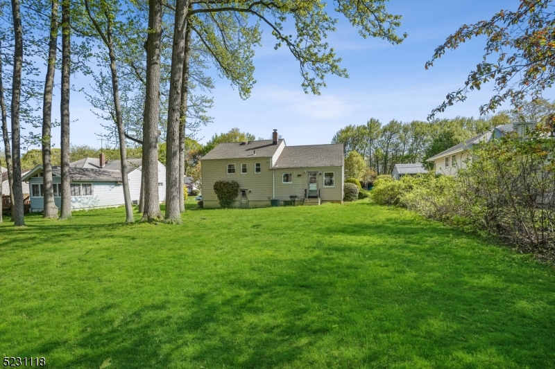 11 North Derby Road Springfield, NJ 07081 - Photo 28 of 30 a view of a garden with a building in the background