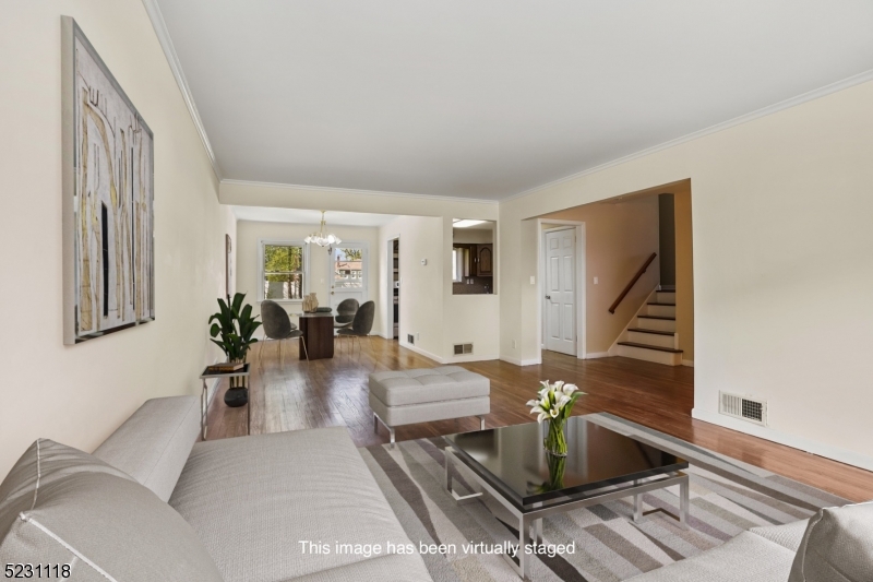 11 North Derby Road Springfield, NJ 07081 - Photo 3 of 30 a living room with furniture and wooden floor