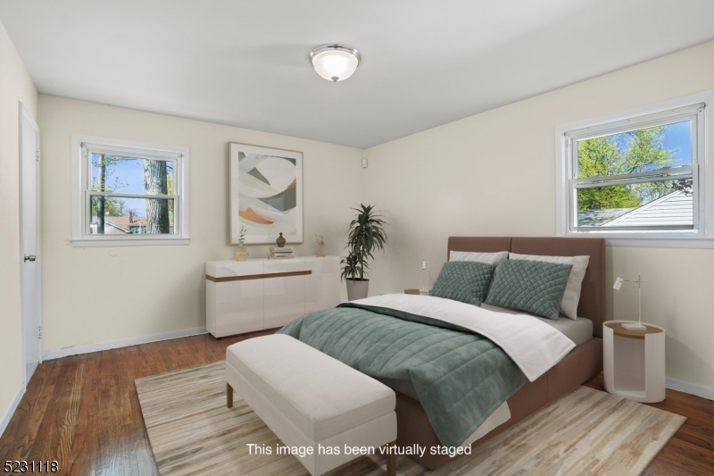 11 North Derby Road Springfield, NJ 07081 - Photo 7 of 30 a bedroom with a large bed and a window