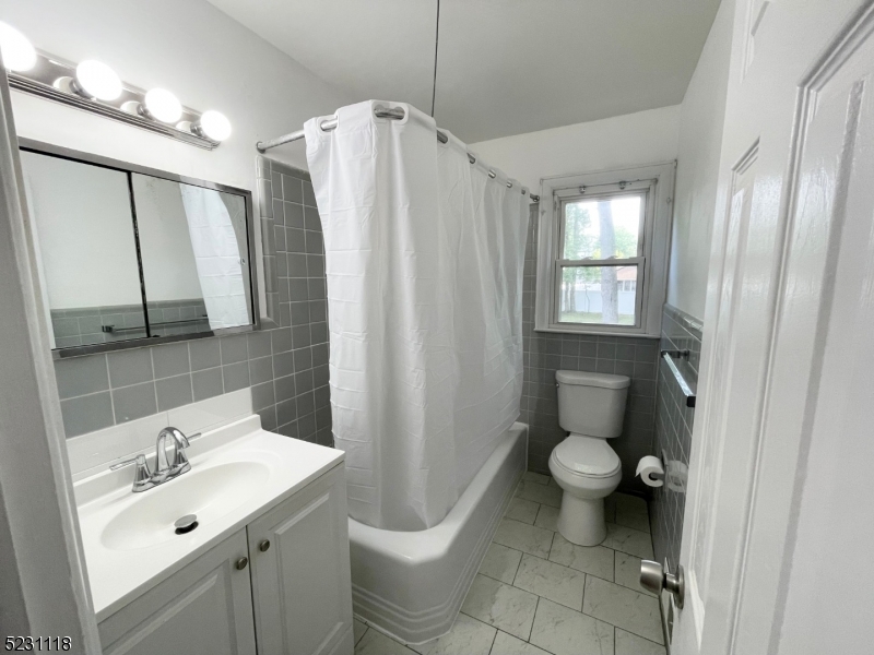 11 North Derby Road Springfield, NJ 07081 - Photo 9 of 30 a bathroom with a sink toilet and shower