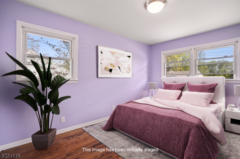 11 North Derby Road Springfield, NJ 07081 - Photo 10 of 30 a bedroom with bed and a potted plant