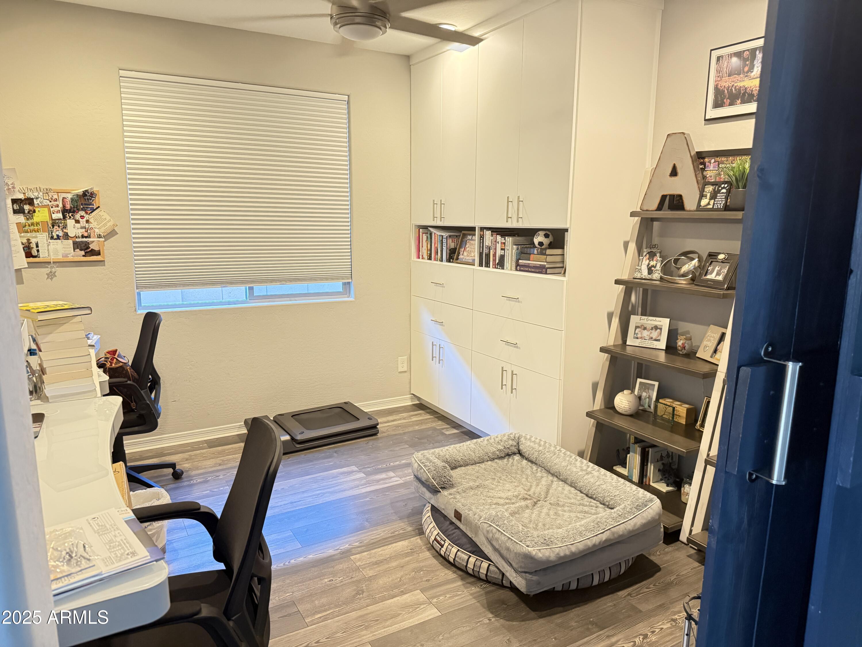 6980 West Redbird Road Peoria, AZ 85383 - Photo 11 of 31 a living room with furniture and a wooden floor