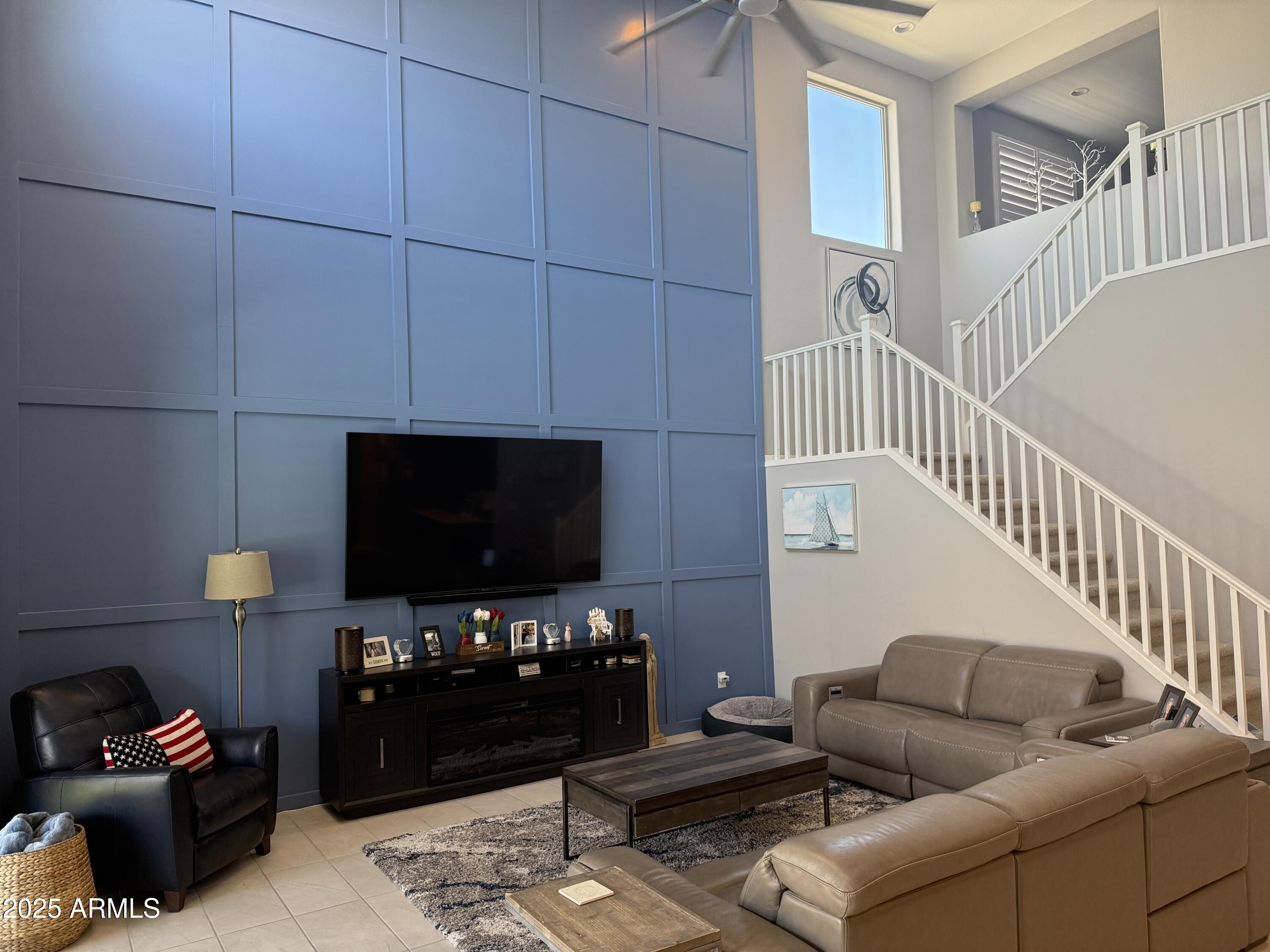 6980 West Redbird Road Peoria, AZ 85383 - Photo 12 of 31 a living room with furniture and a flat screen tv