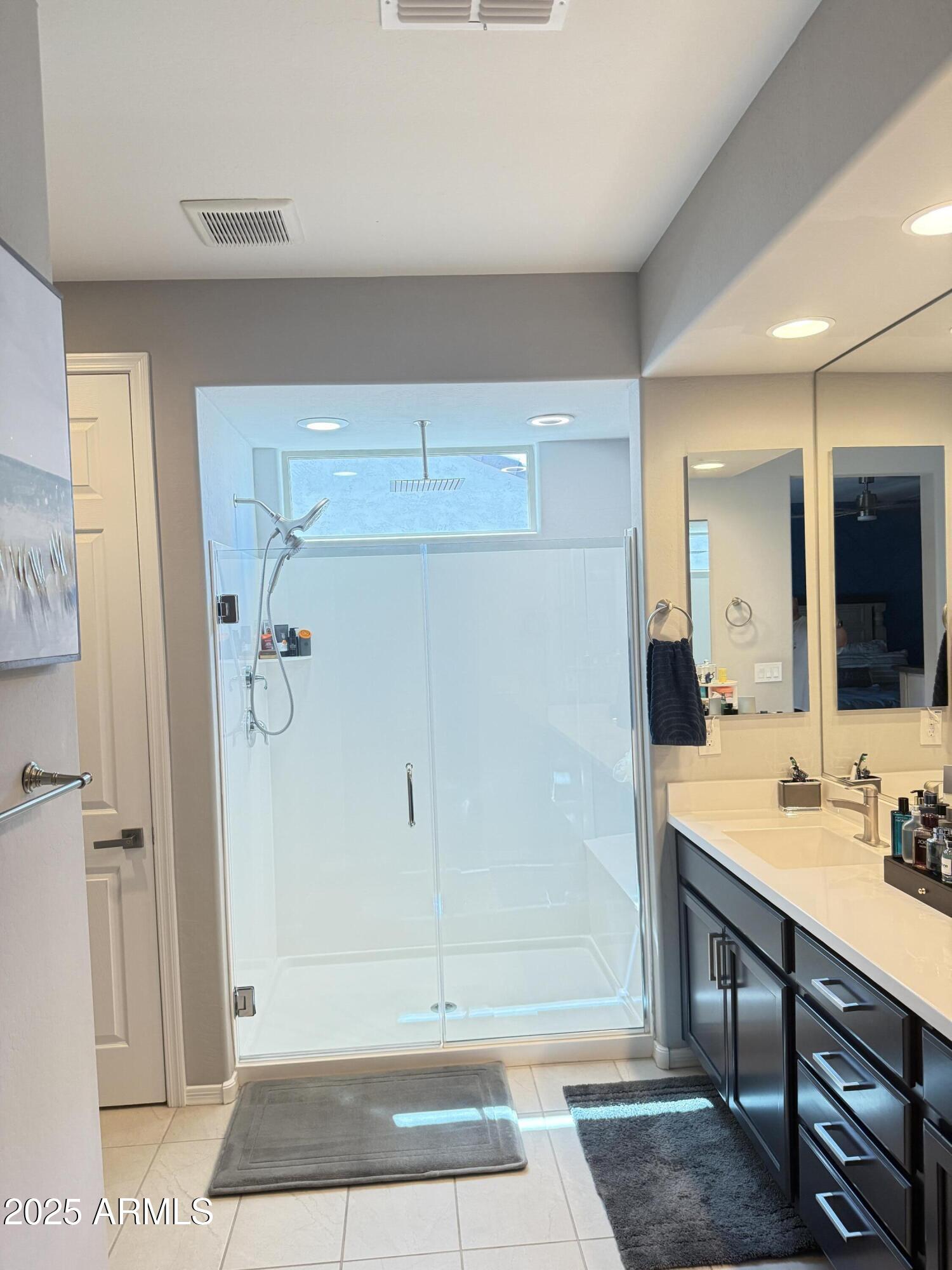 6980 West Redbird Road Peoria, AZ 85383 - Photo 17 of 31 a bathroom with a shower and a sink