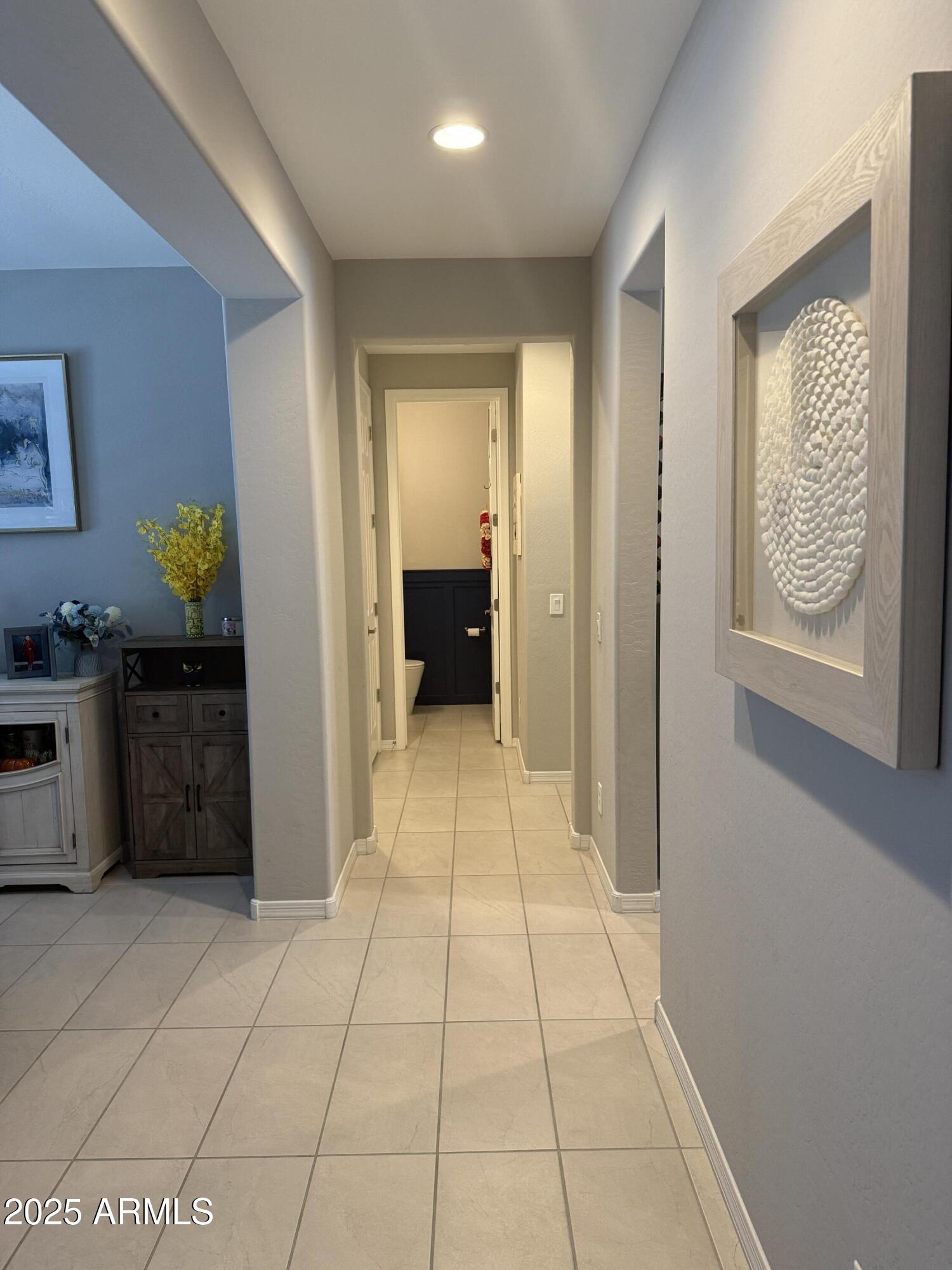 6980 West Redbird Road Peoria, AZ 85383 - Photo 23 of 31 a view of hallway with a couch and a dresser