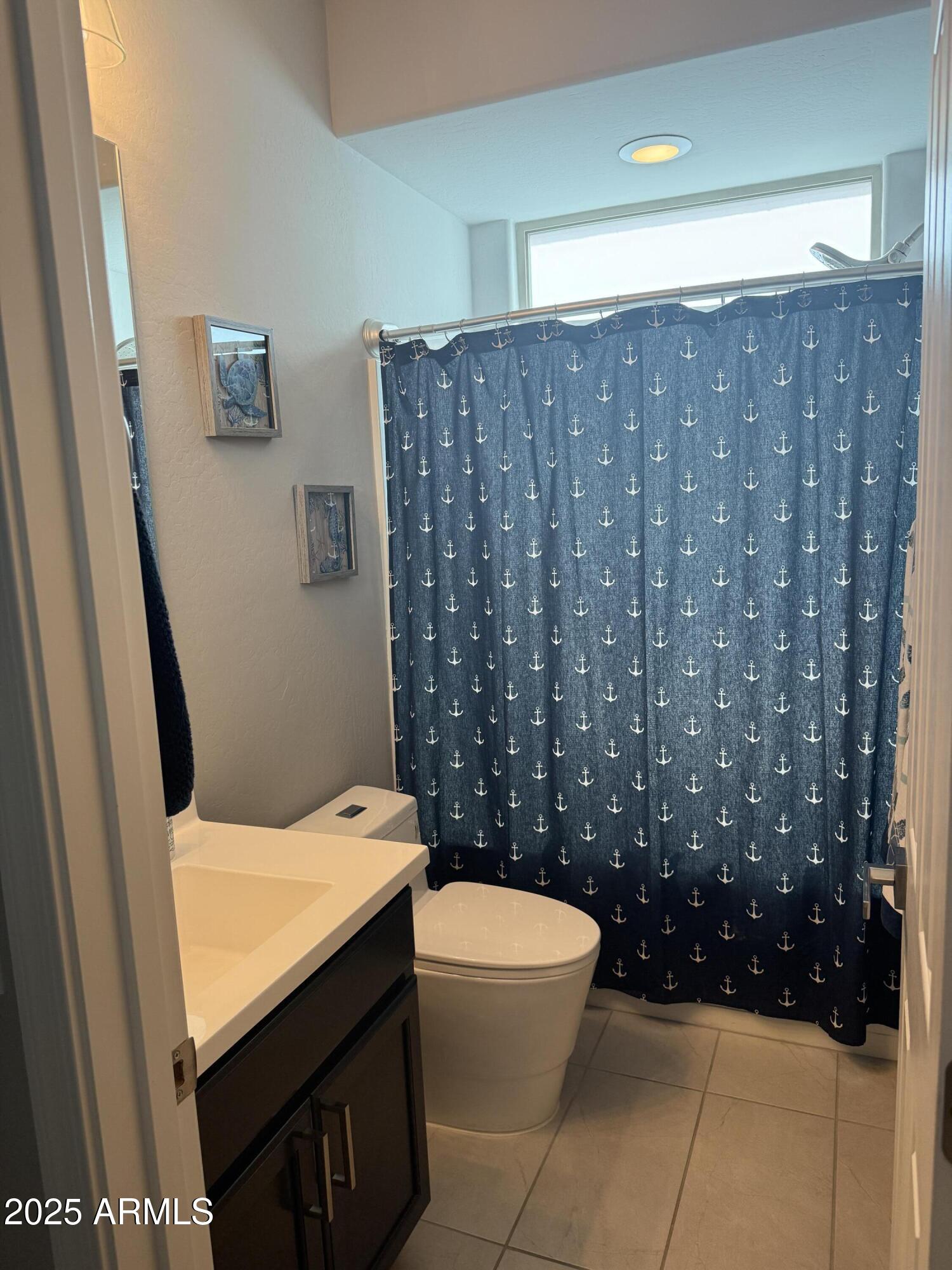 6980 West Redbird Road Peoria, AZ 85383 - Photo 25 of 31 a bathroom with a sink and toilet