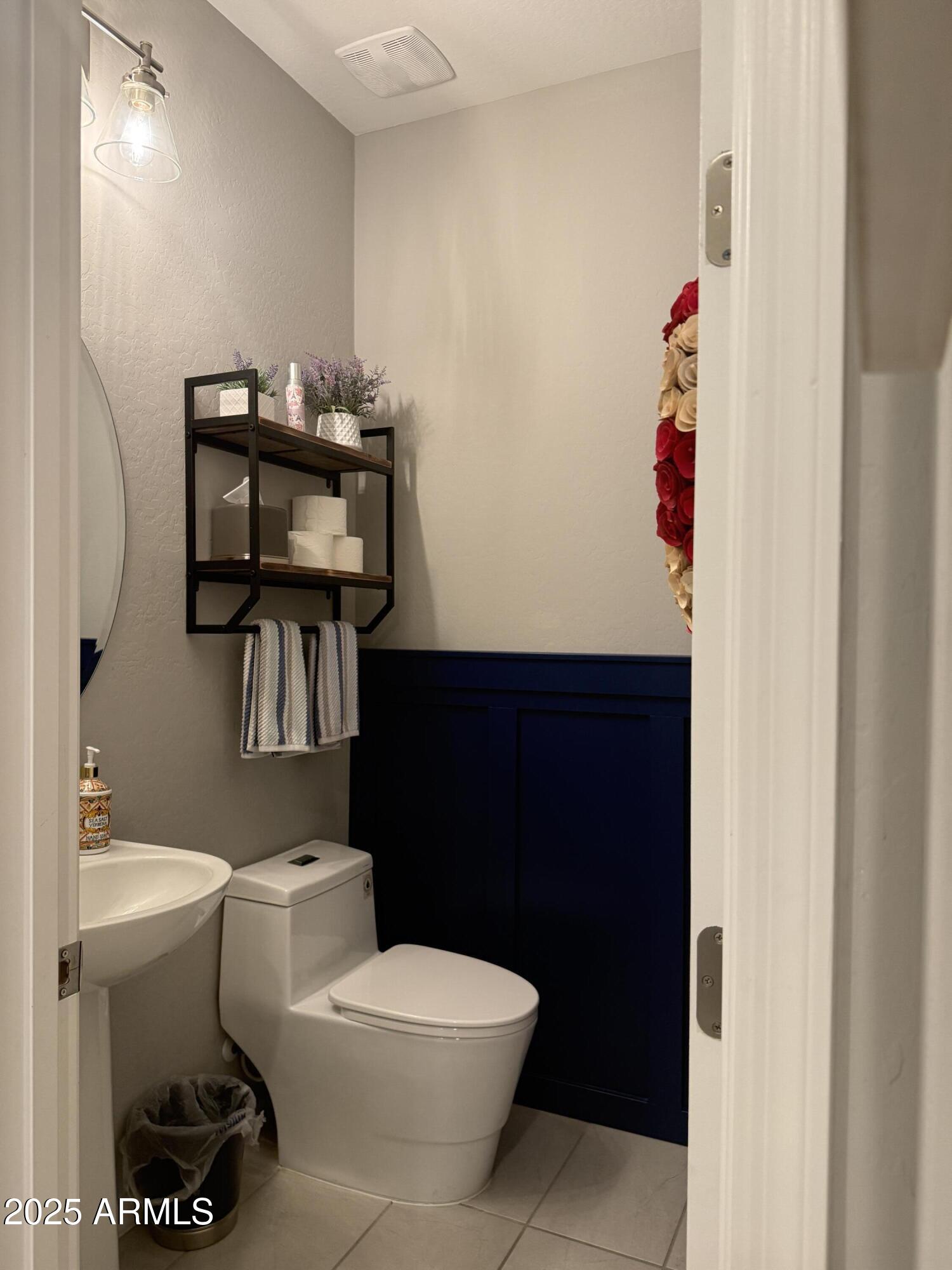 6980 West Redbird Road Peoria, AZ 85383 - Photo 26 of 31 a bathroom with a toilet and a sink