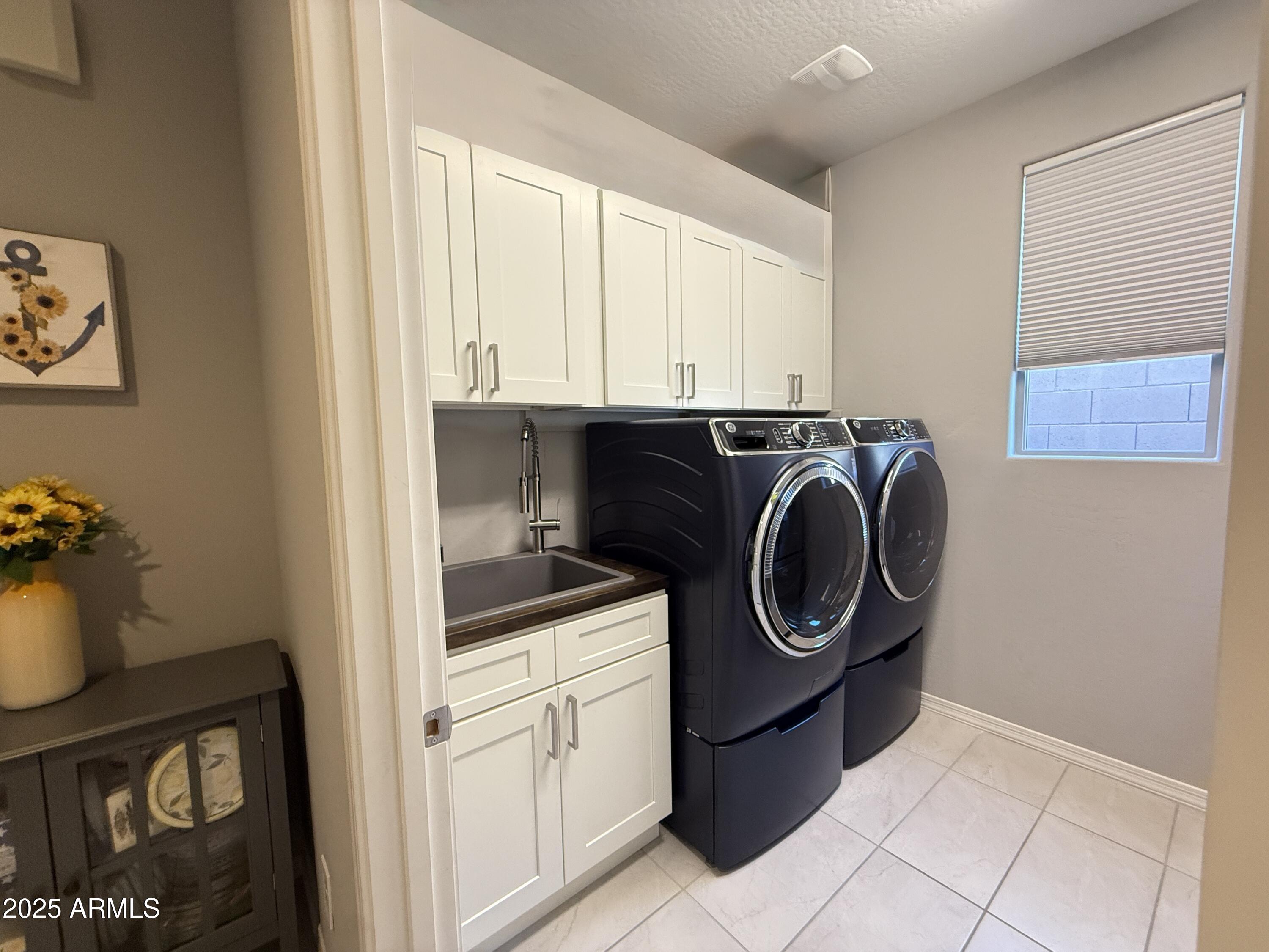 6980 West Redbird Road Peoria, AZ 85383 - Photo 28 of 31 a utility room with sink dryer and washer