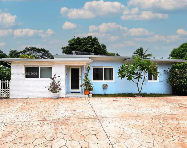 a house with yard in front of it