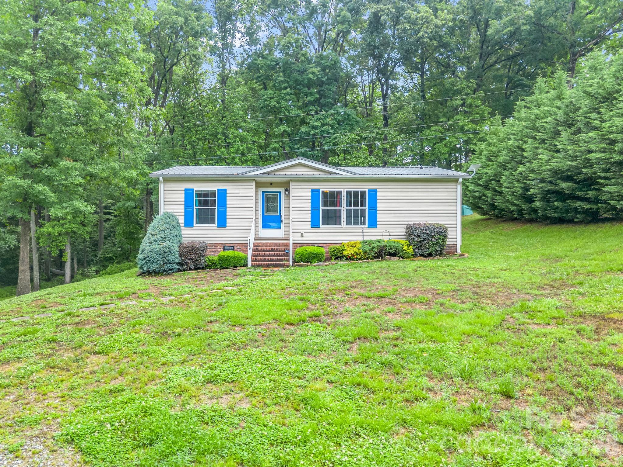 1449 Toney Road Bostic, NC 28018 - Photo 7 of 43 a front view of house with yard and green space