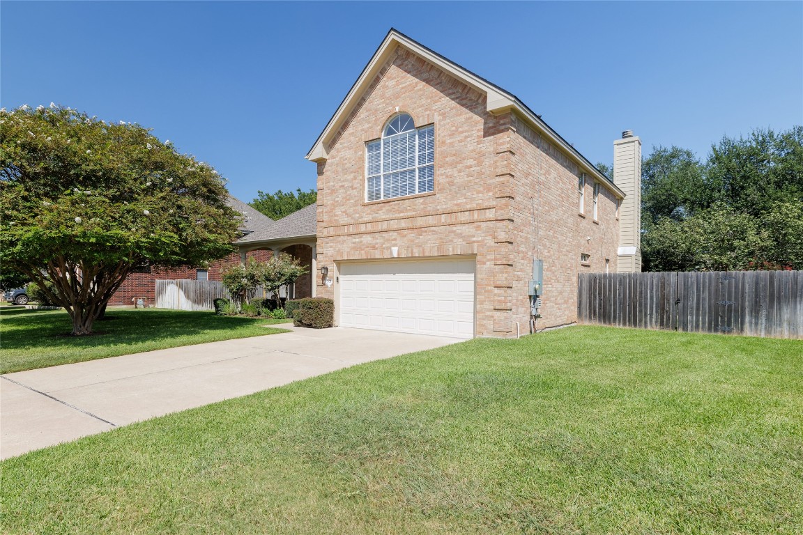205 Ridge Run Court Georgetown, TX 78628 - Photo 11 of 40 a view of a house with a yard and pathway