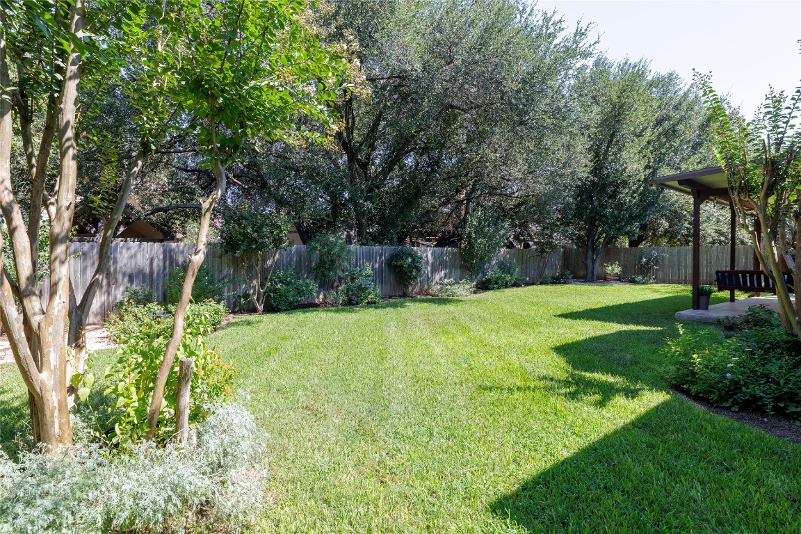 205 Ridge Run Court Georgetown, TX 78628 - Photo 13 of 40 a view of a backyard with large trees