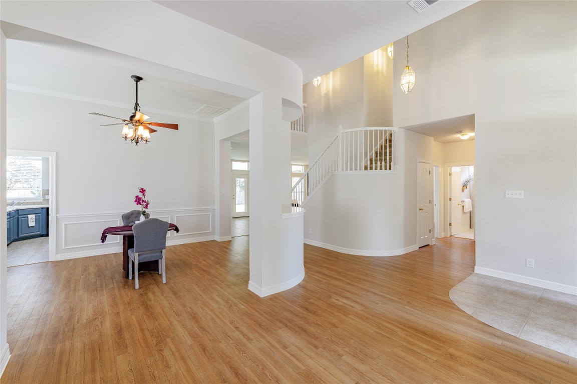 205 Ridge Run Court Georgetown, TX 78628 - Photo 15 of 40 a living room with furniture and a chandelier