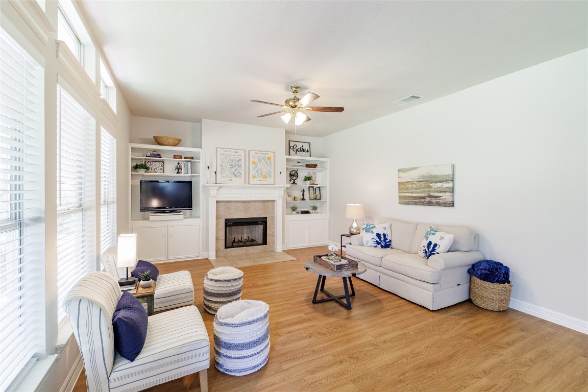 205 Ridge Run Court Georgetown, TX 78628 - Photo 21 of 40 a living room with furniture a fireplace and a large window