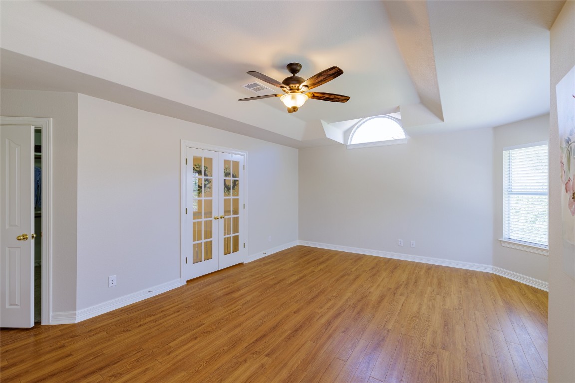205 Ridge Run Court Georgetown, TX 78628 - Photo 25 of 40 a view of an empty room with window and wooden floor