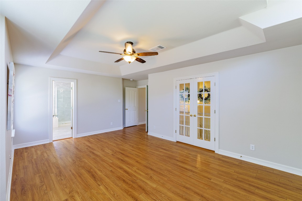 205 Ridge Run Court Georgetown, TX 78628 - Photo 26 of 40 a view of an empty room with a window and wooden floor