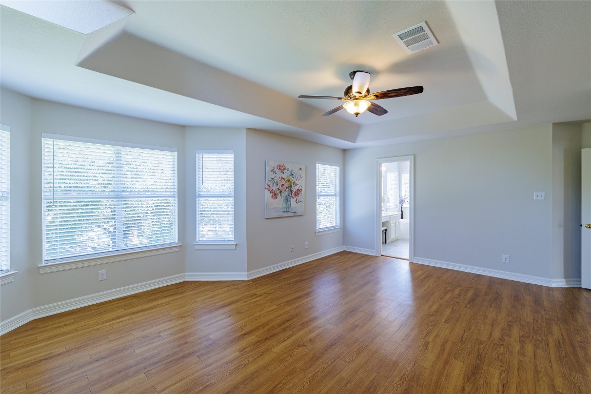 205 Ridge Run Court Georgetown, TX 78628 - Photo 27 of 40 a view of an empty room with window and wooden floor