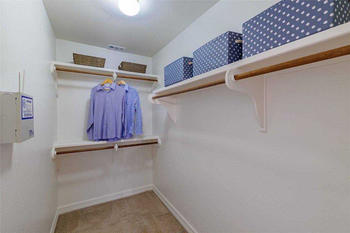 205 Ridge Run Court Georgetown, TX 78628 - Photo 28 of 40 a view of a room with rack on the wall