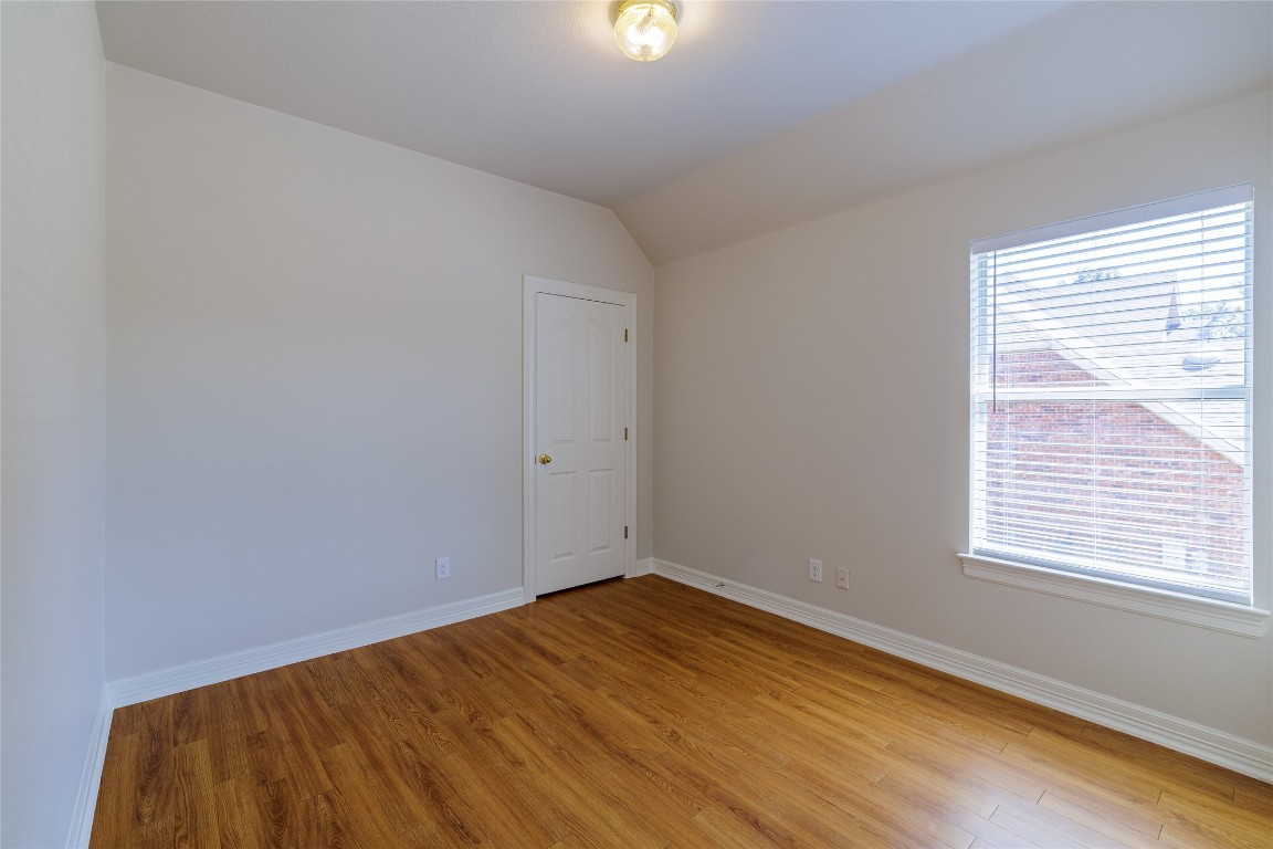 205 Ridge Run Court Georgetown, TX 78628 - Photo 31 of 40 a view of an empty room with wooden floor and a window
