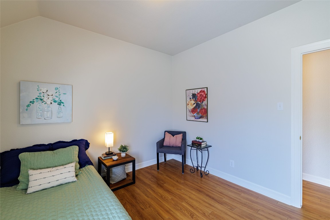 205 Ridge Run Court Georgetown, TX 78628 - Photo 33 of 40 a bedroom with furniture and a wooden floor