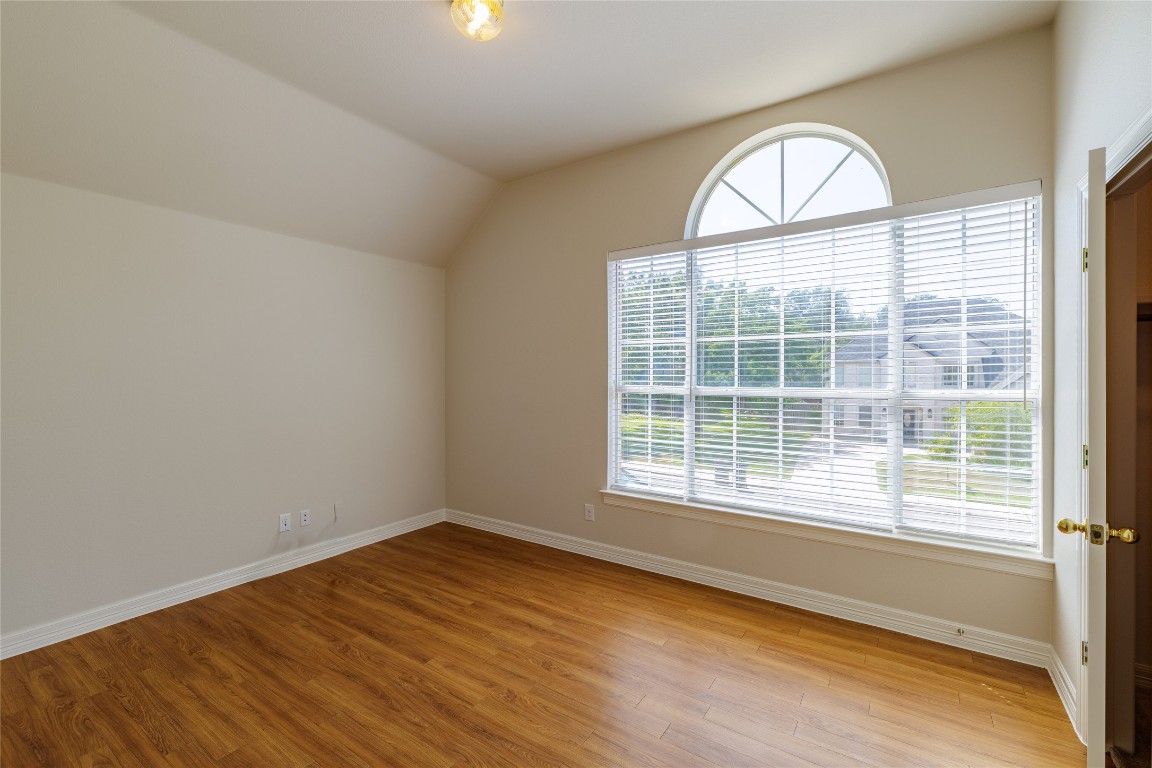 205 Ridge Run Court Georgetown, TX 78628 - Photo 34 of 40 an empty room with wooden floor and windows