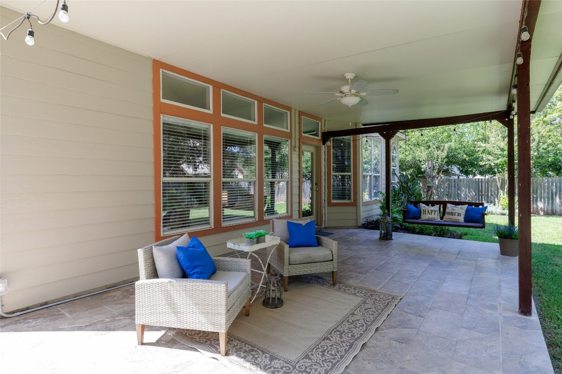 205 Ridge Run Court Georgetown, TX 78628 - Photo 37 of 40 a living room with furniture and a floor to ceiling window