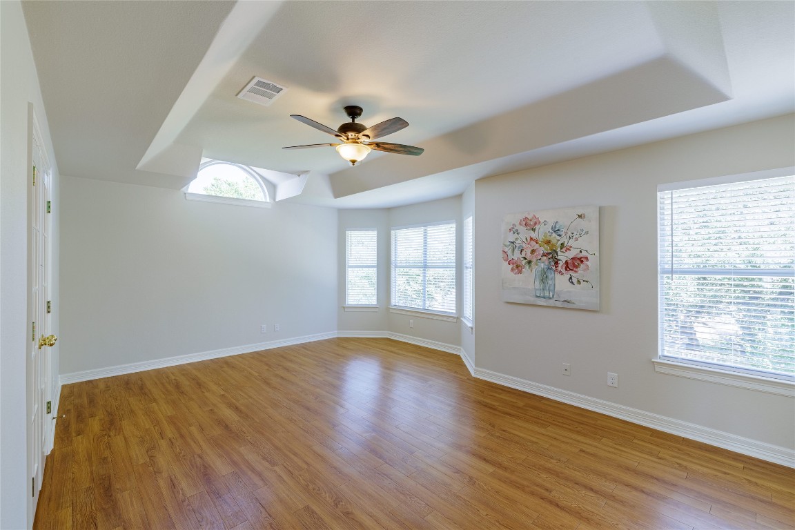 205 Ridge Run Court Georgetown, TX 78628 - Photo 7 of 40 a view of livingroom with window ceiling fan and hardwood floor