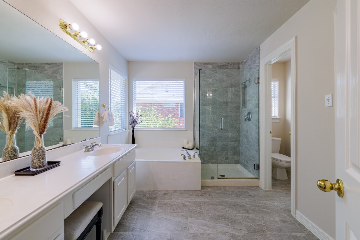 205 Ridge Run Court Georgetown, TX 78628 - Photo 8 of 40 a bathroom with a tub sink and mirror